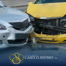 Two cars with significant damage after a front-end collision in Jupiter, FL