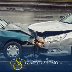 Two cars colliding head-on in Palm Beach Gardens, FL