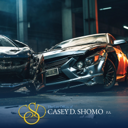 Two damaged cars after a head-on collision in Palm Beach Gardens, FL