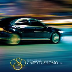 A car speeding down the road in Palm Beach Gardens, creating a dangerous situation for pedestrians and other drivers